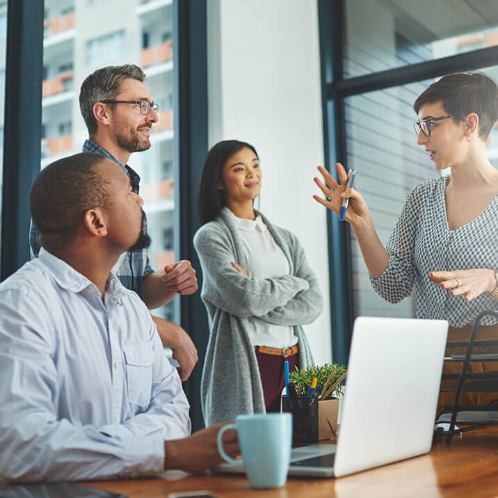 woman-talking-meeting-laptop difference equiton real estate investing